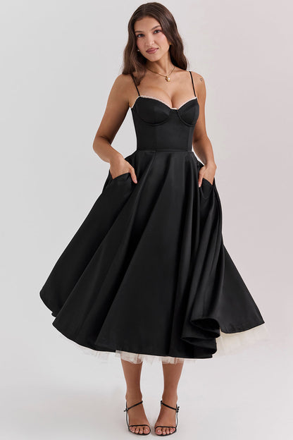 Woman wearing a black dress on a white background