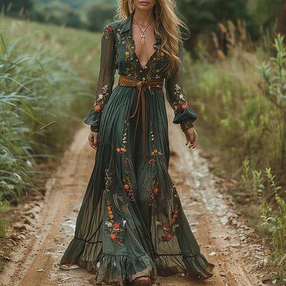 Woman in a long, ornate dress walking on a dirt path in a natural setting