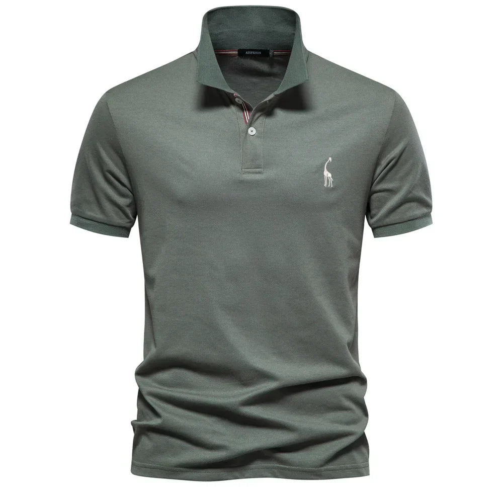 Green polo shirt with a small logo on a white background