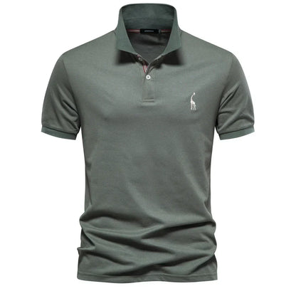 Green polo shirt with a small logo on a white background