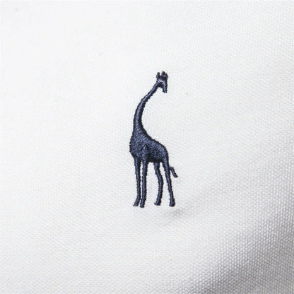 Embroidered giraffe design on a white fabric background