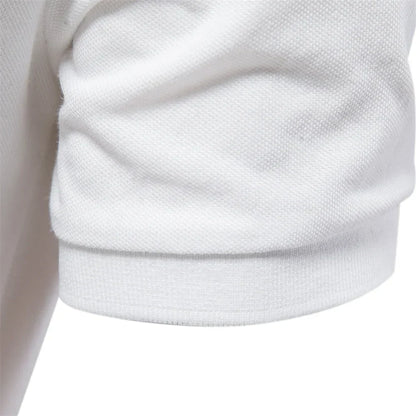 Close-up of a white textured fabric sleeve on a plain background