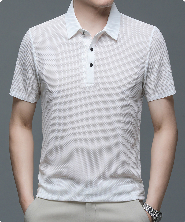 White textured polo shirt worn by a person on a gray background