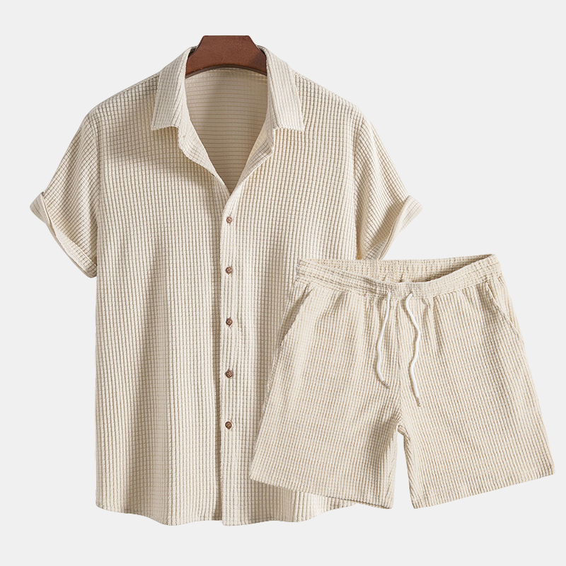 Beige checkered shirt and shorts set on a white background