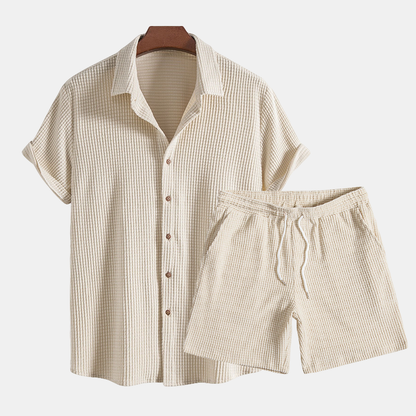 Beige checkered shirt and shorts set on a white background