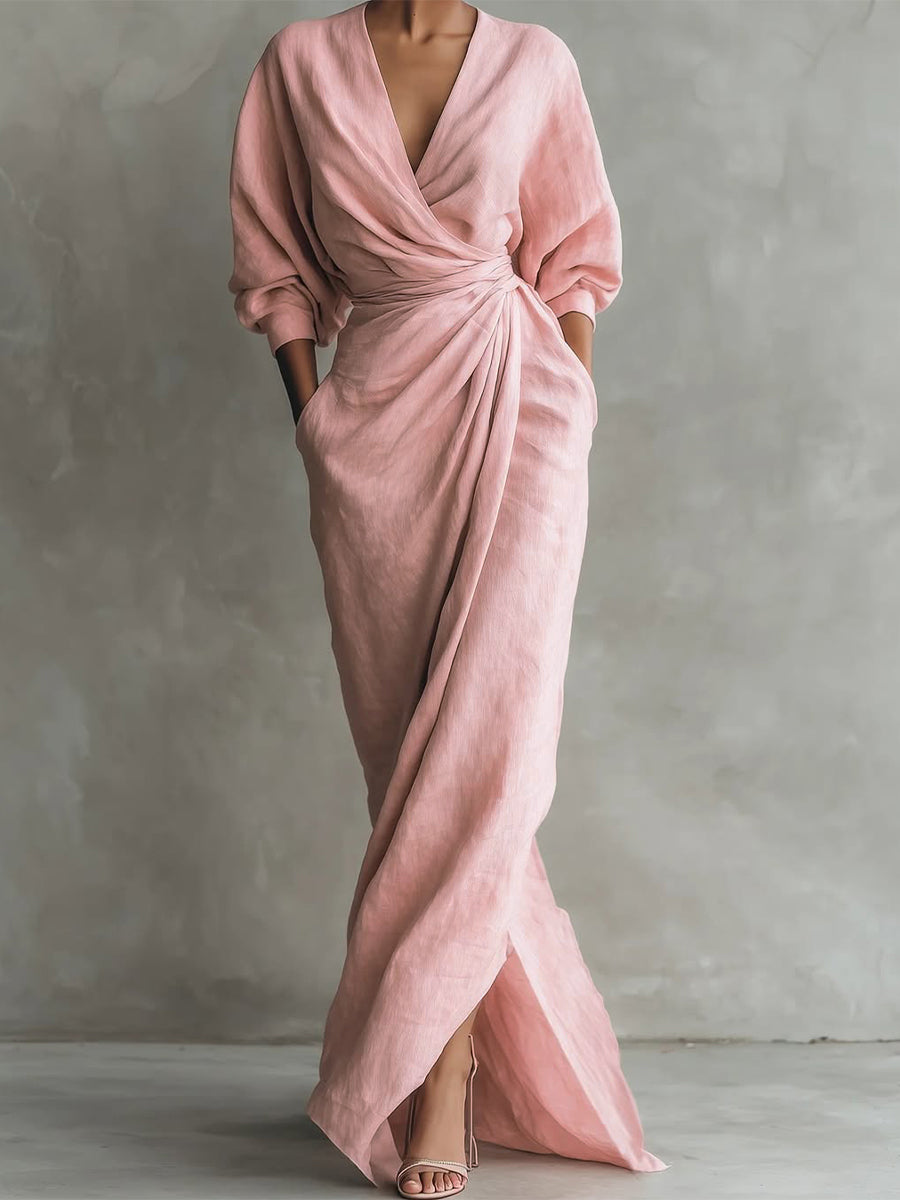 Pink evening gown on a mannequin against a gray background
