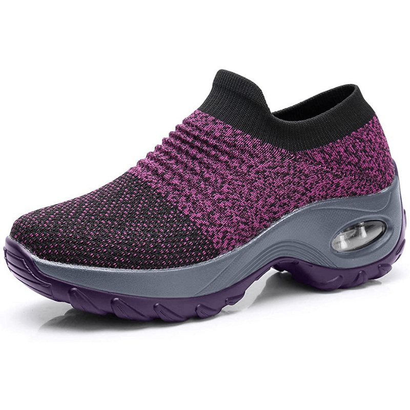 Purple and black sneaker with a gray sole on a white background
