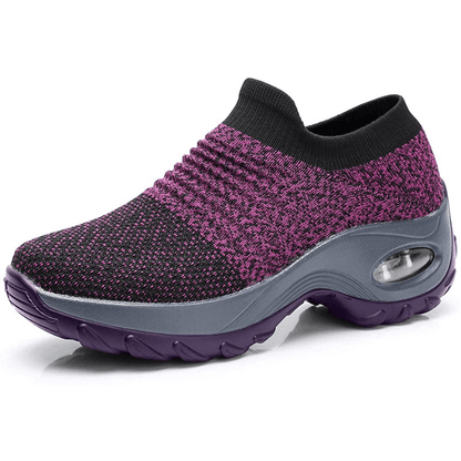 Purple and black sneaker with a gray sole on a white background