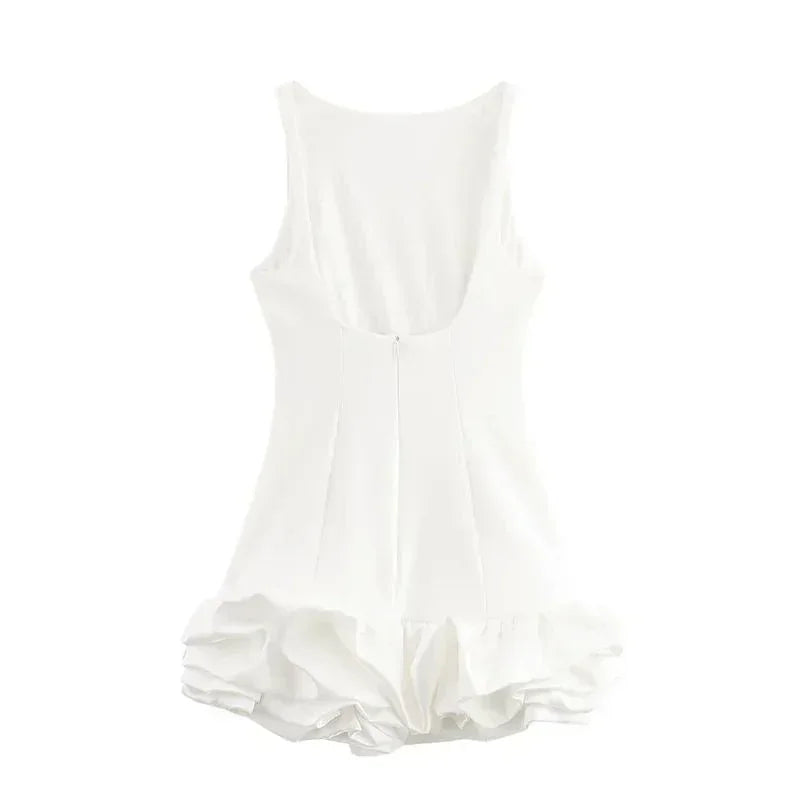 White sleeveless dress with ruffled hem on a white background
