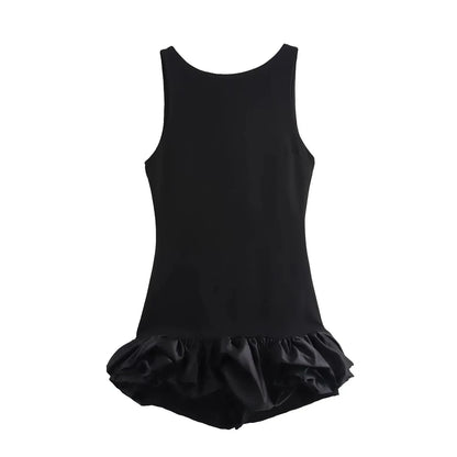 Black dress with a ruffled skirt on a white background