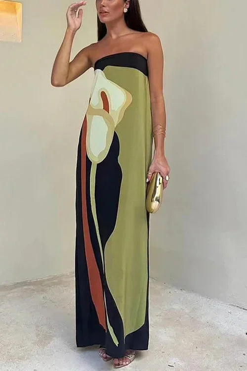 Woman wearing a strapless dress with abstract design in a minimal indoor setting