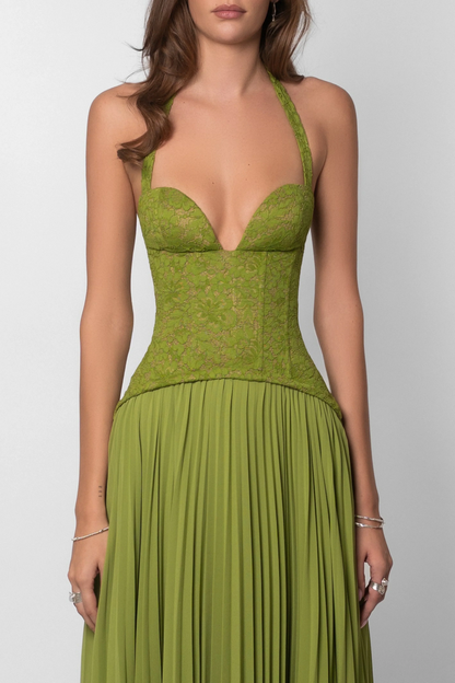 Green evening gown with a plunging neckline on a white background