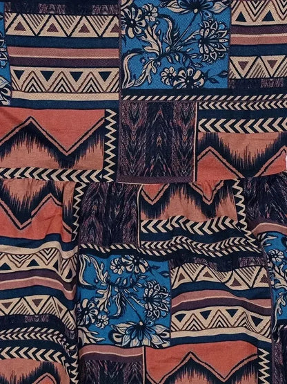 Patterned fabric with tribal and floral designs in blue, orange, and purple.