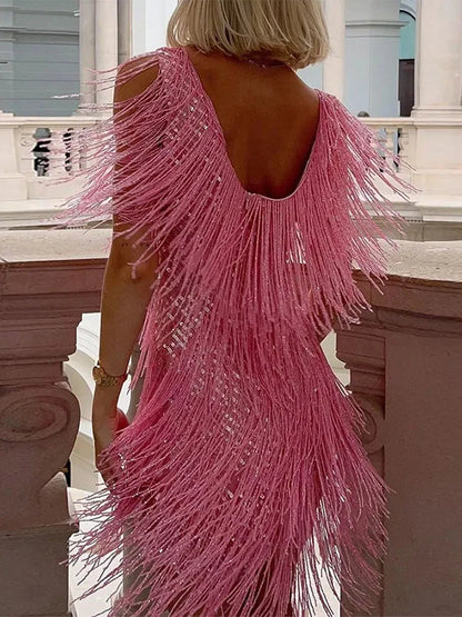 Pink fringe dress worn by a person on a classical building staircase