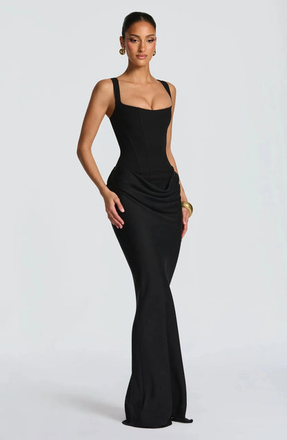 Woman wearing a black evening gown on a white background