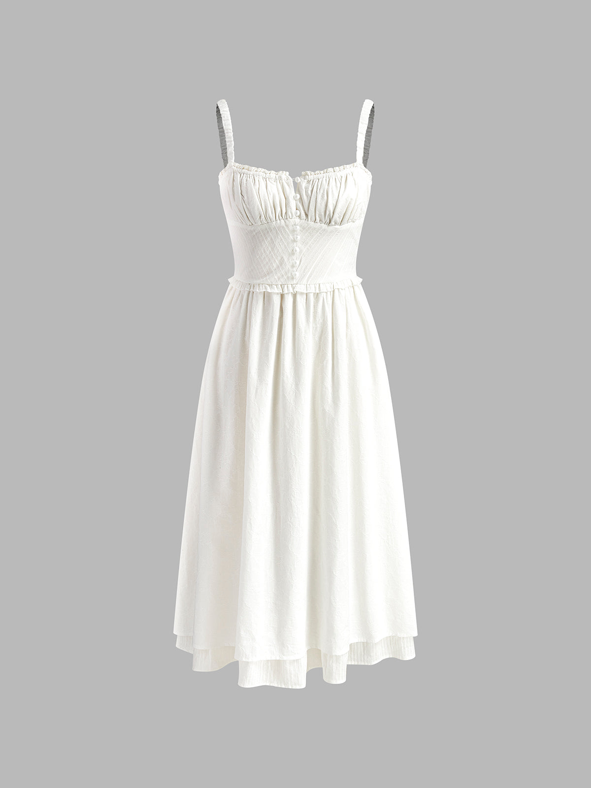 White dress with thin straps on a gray background