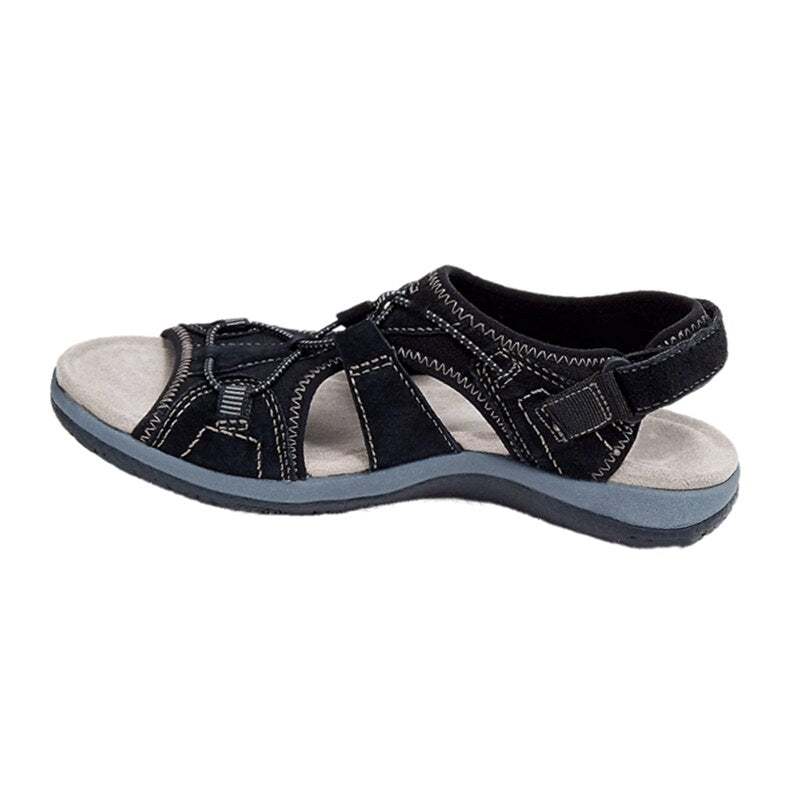 Black sandal with gray sole on a white background