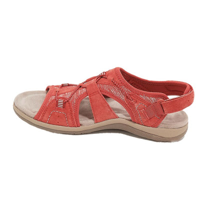 Red sandal with beige sole on a white background