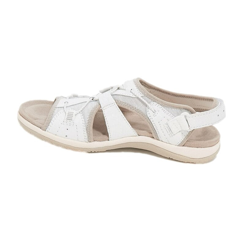 White sandal with beige accents on a white background