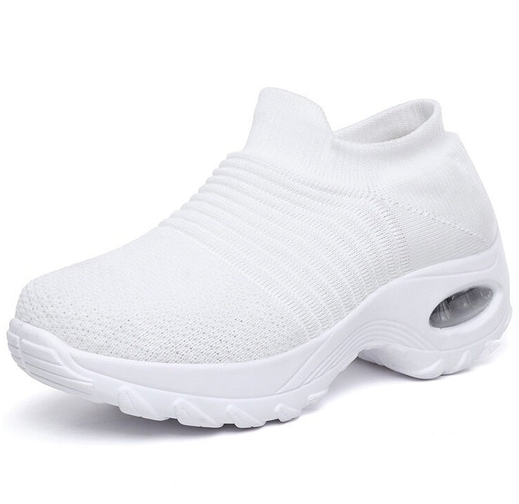 White slip-on sneaker on a white background
