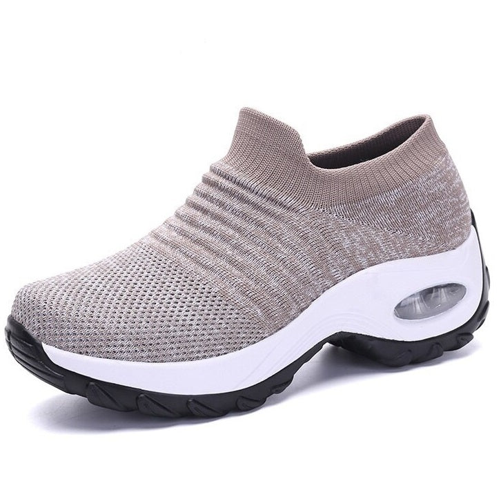Gray slip-on sneaker with white sole on a white background