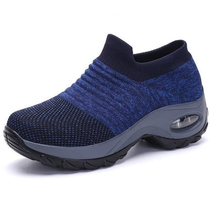 Blue and gray athletic shoe on a white background