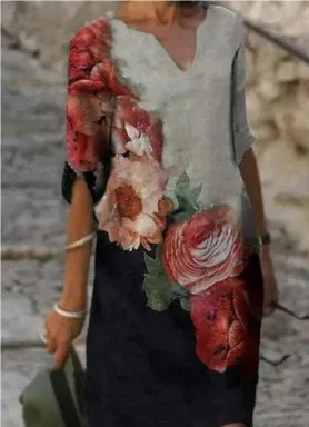 Person wearing a floral dress with a blurred background
