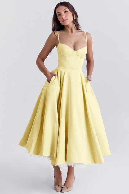 Woman wearing a yellow dress on a white background